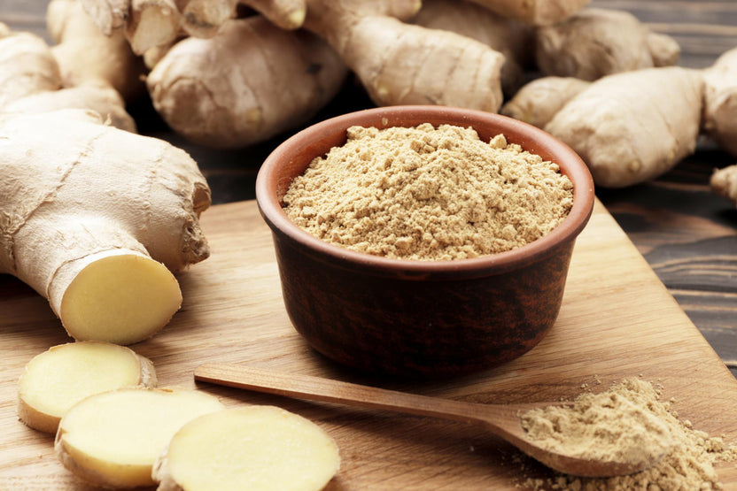 Close-up of panax ginseng with panax ginseng powder on a board