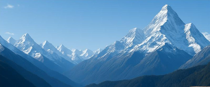 Snow-capped mountain peaks under a clear blue sky